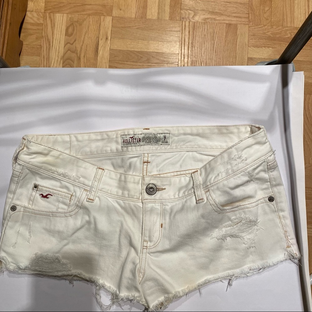 Distressed white short shorts